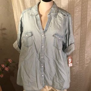 Light denim button up shirt.
